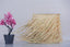 Fringed straw lampshade