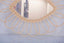 Mirror in rattan eye