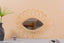 Mirror in rattan eye