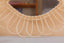 Mirror in rattan eye