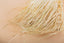 Fringed straw lampshade