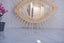 Mirror in rattan eye