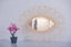 Mirror in rattan eye