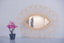 Mirror in rattan eye
