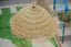 Umbrella-shaped suspension in braided natural fiber doum straw