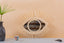Mirror in rattan eye