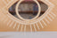 Mirror in rattan eye