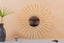 Mirror in rattan eye