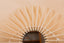 Mirror in rattan eye